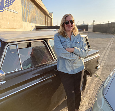 Desiree Salas standing by her car